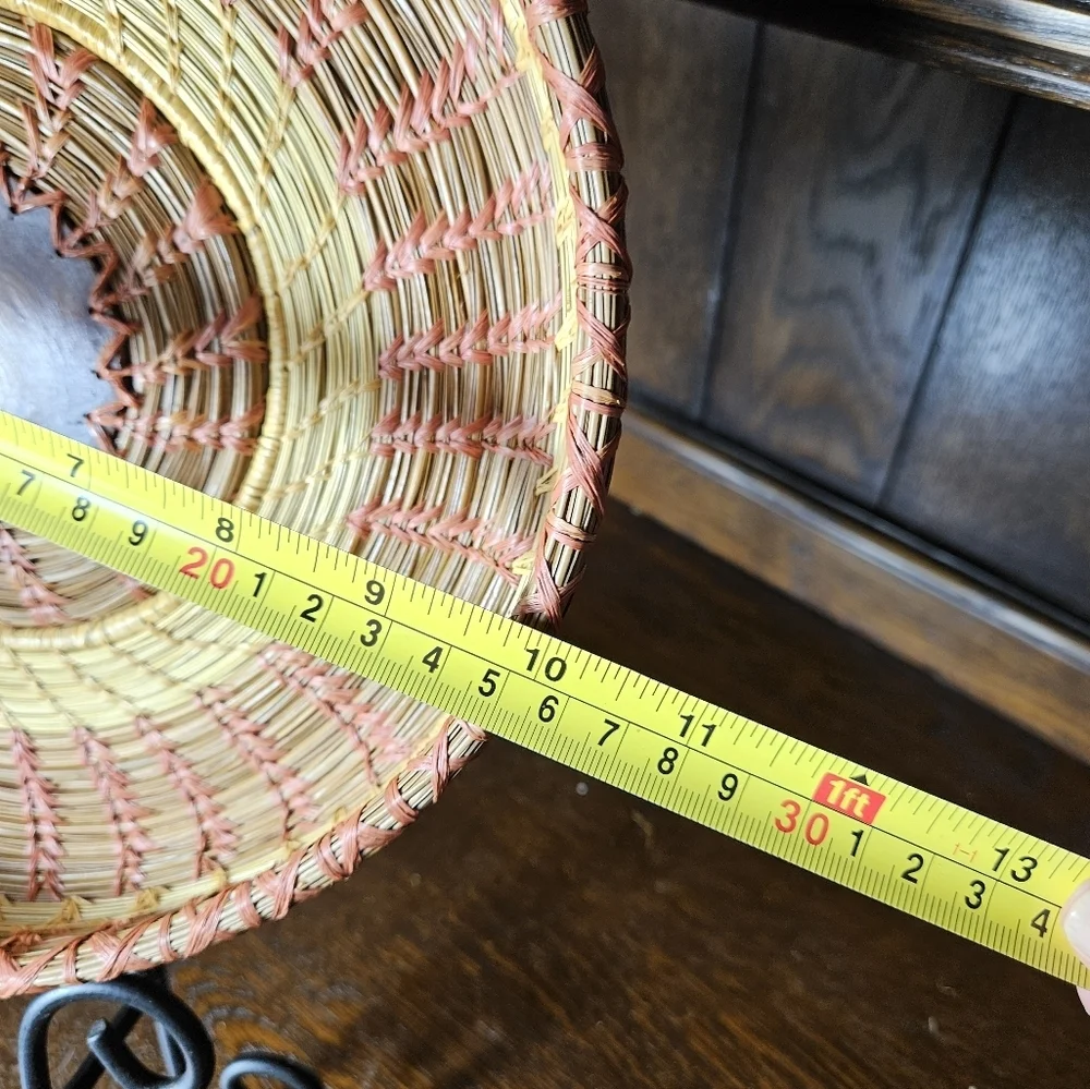 Primitive Handwoven 10 Inche Basket With A Wood Medallian In The Middle.